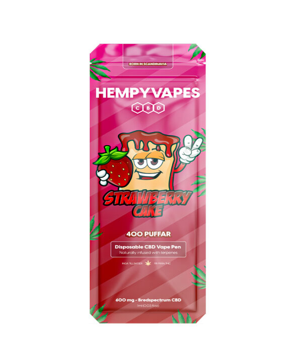 Nærbillede af Strawberry Cake HempyVapes-emballage med kage-maskot der viser fredstegn